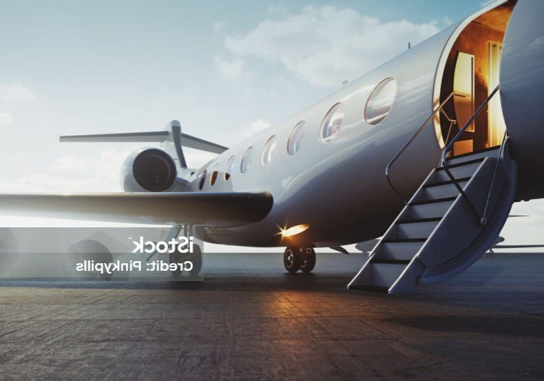 Closeup view of business jet airplane parked at outside and waiting vip persons. Luxury tourism and business travel transportation concept. 3d rendering